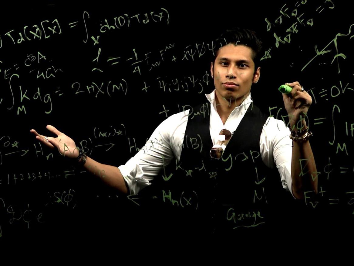 Ahnaf standing behind a glass board covered in mathematical equations, dramatically lit, peering through the equations.