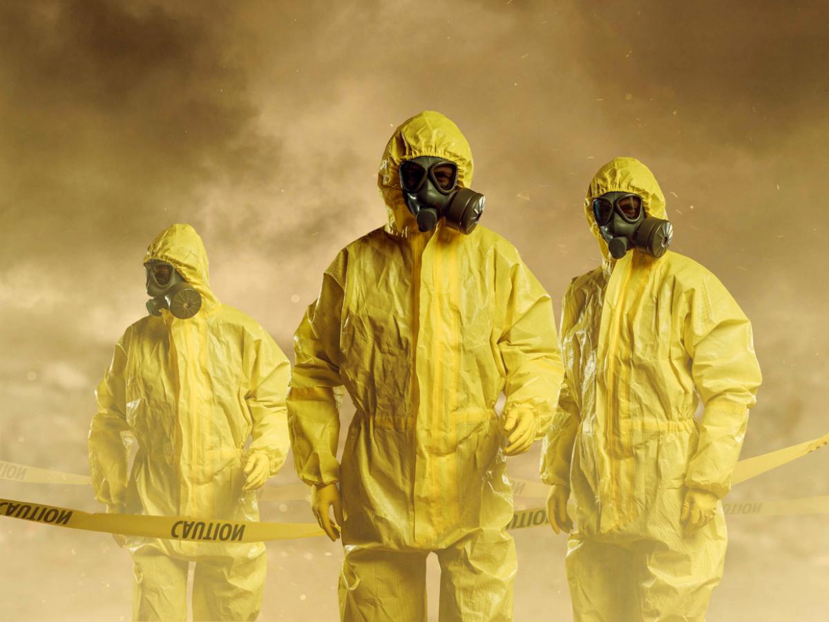 People wearing protective suits as part of biosecurity. iStock image by D Keine. 