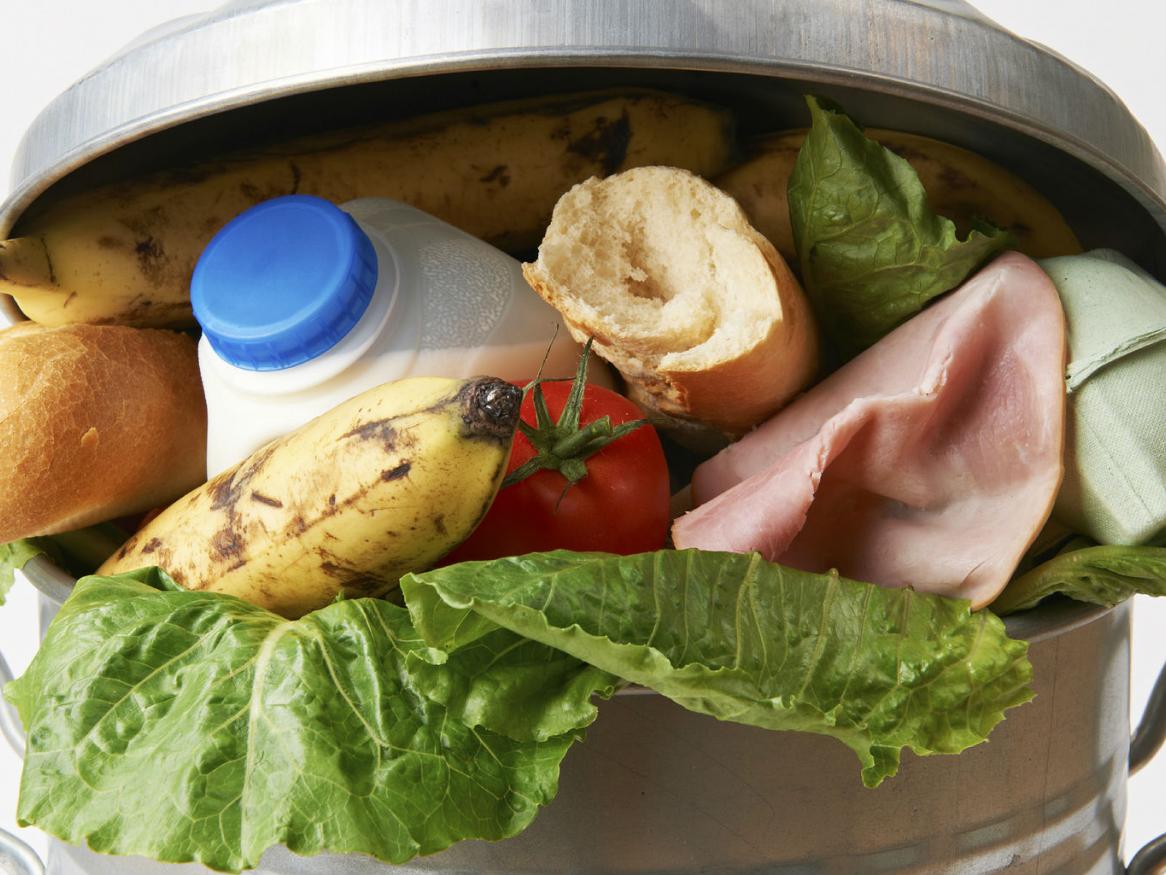 Food waste in garbage can image
